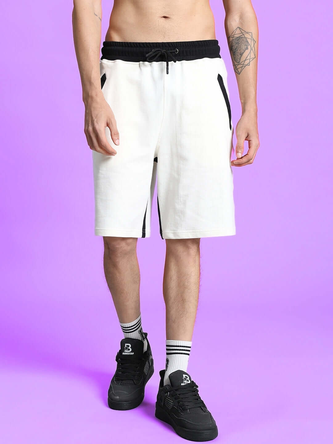 SPLINTER REGULAR FIT SHORTS OFF WHITE on a model against a purple background, showcasing sleek design and comfortable fit.