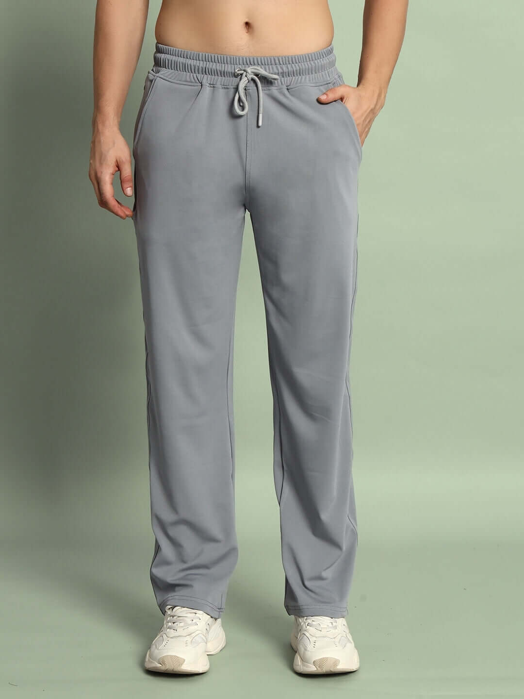 Man wearing grey Springy Relaxed Fit Jogger, highlighting comfortable fit and style. Made to order by DUDS, available for custom sizing.