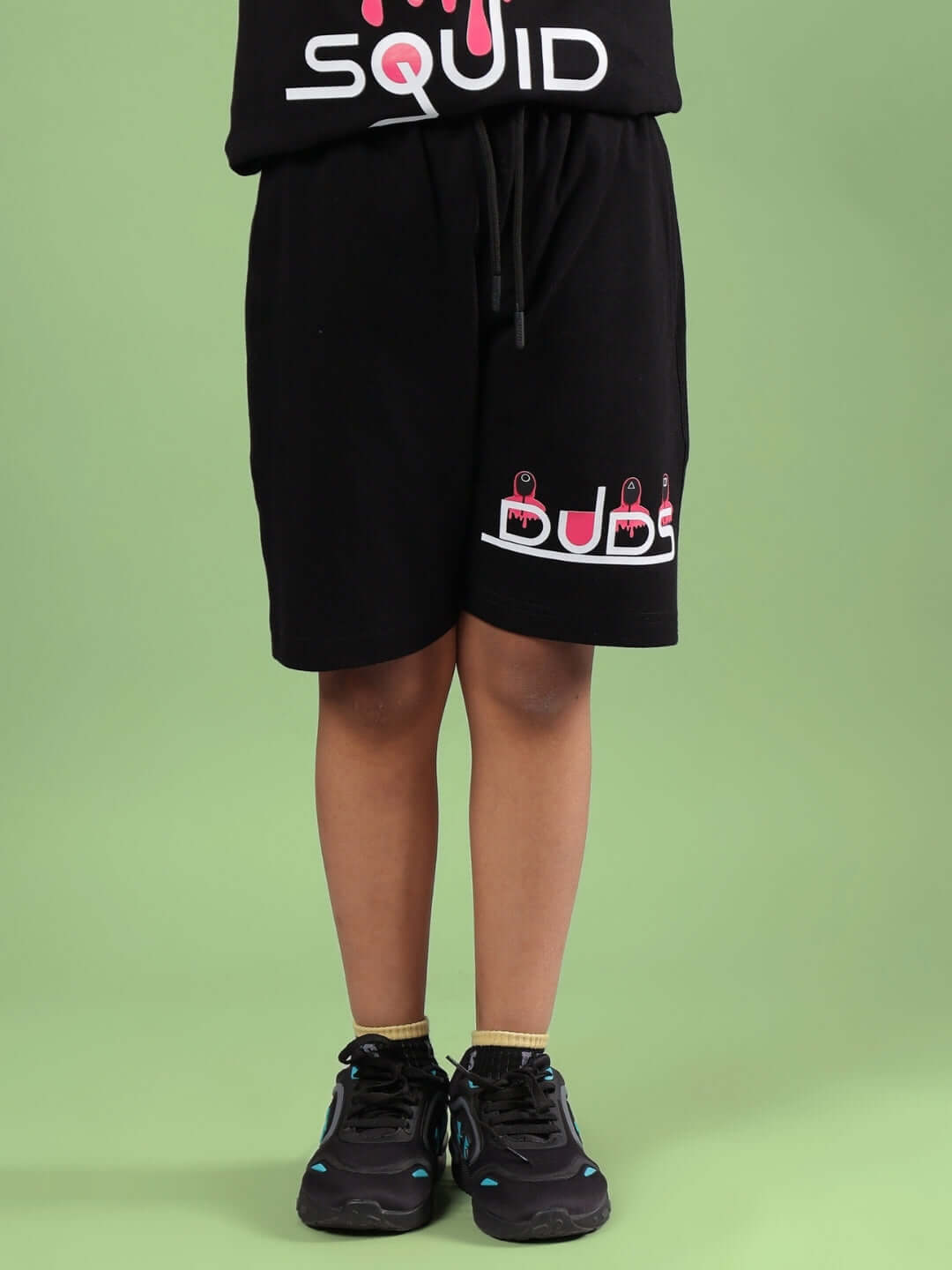 Black SQUID GAME shorts for boys and girls by DUDS, modeled by a child, featuring custom size options and premium tailoring.