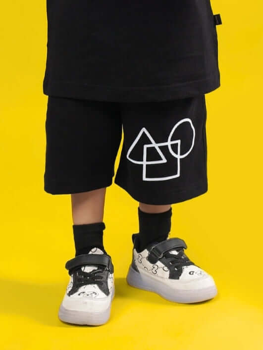 Children's black squid battle shorts by DUDS with geometric print, suitable for boys and girls. Made-to-order casual wear.