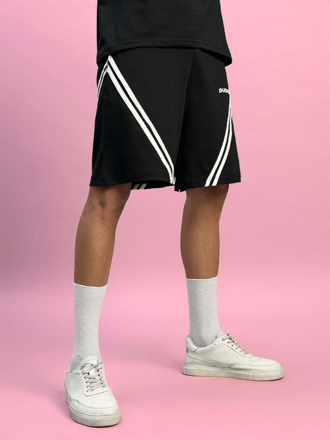 Alt Tag: STAR JUMPER black shorts with white stripes, regular fit, customizable sizing, worn by model, stylish and handmade for comfort.