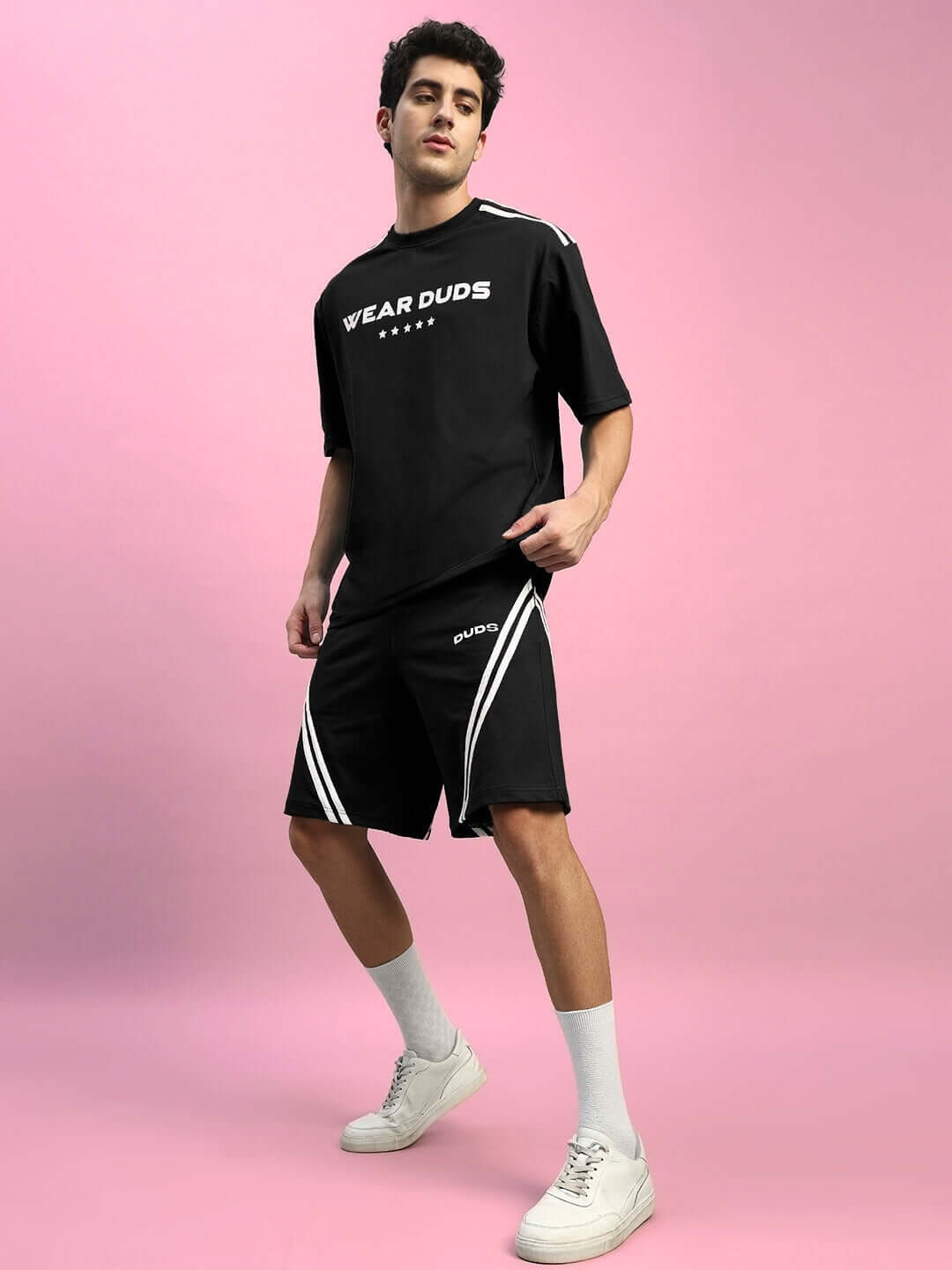 Man wearing STAR JUMPER Summer Co-ord Set (Black) made from premium cotton with a stylish design, suitable for summer fashion trends.