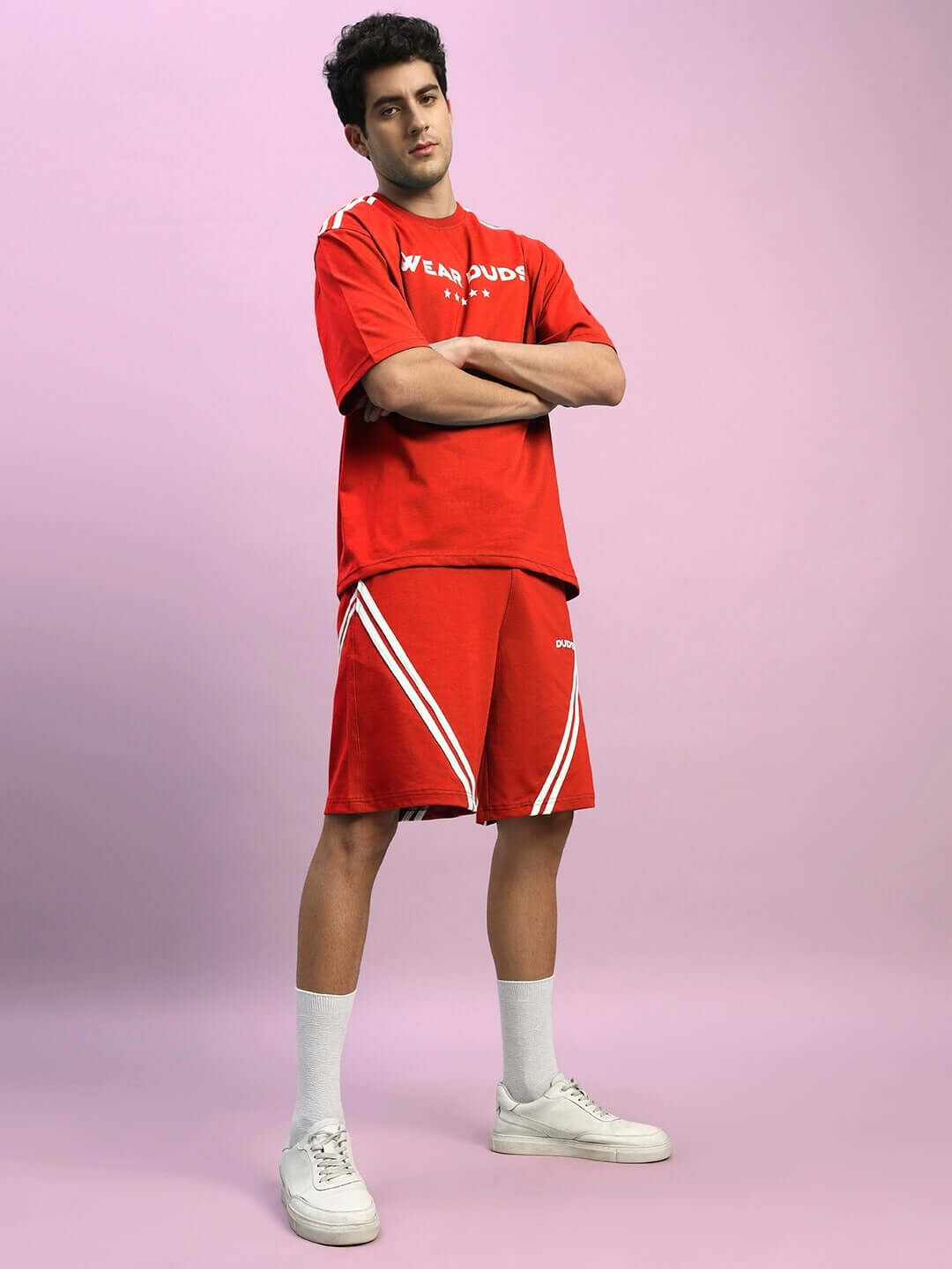 Model wearing red STAR JUMPER summer co-ord set, made from premium cotton fabric with terry lycra. Ideal for stylish and comfortable wear.