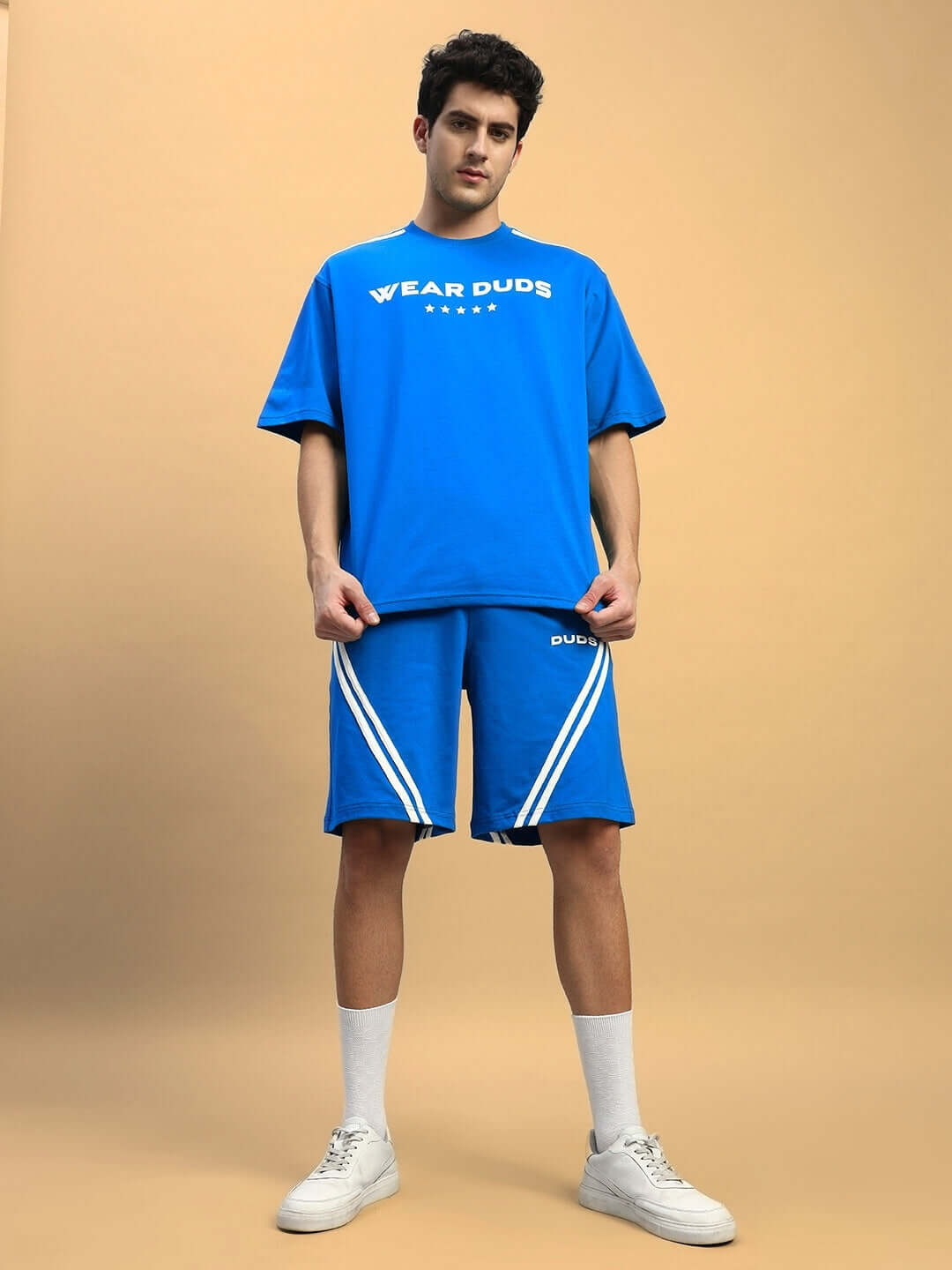 Man wearing STAR JUMPER Summer Co-ord Set in royal blue, featuring a casual tee and shorts with a sporty design, ideal for summer fashion.