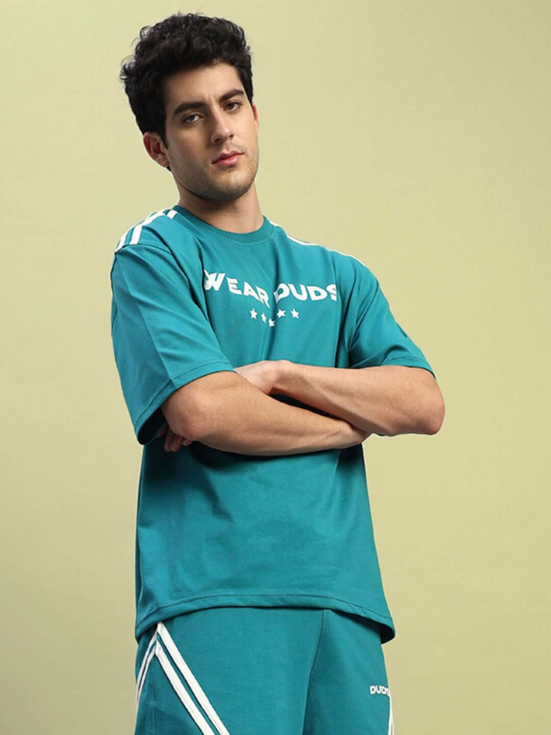 Model wearing Star Jumper Over-Sized T-Shirt in teal, featuring premium cotton fabric. Perfect for a trendy, casual style. Made in India.