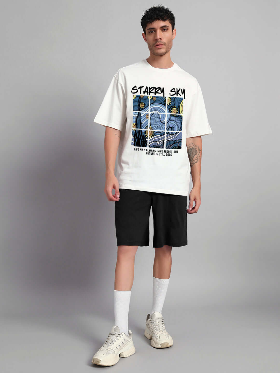 Model wearing Starry Sky Co-ord Set in off white and black, featuring a premium cotton t-shirt with graphic and matching shorts.