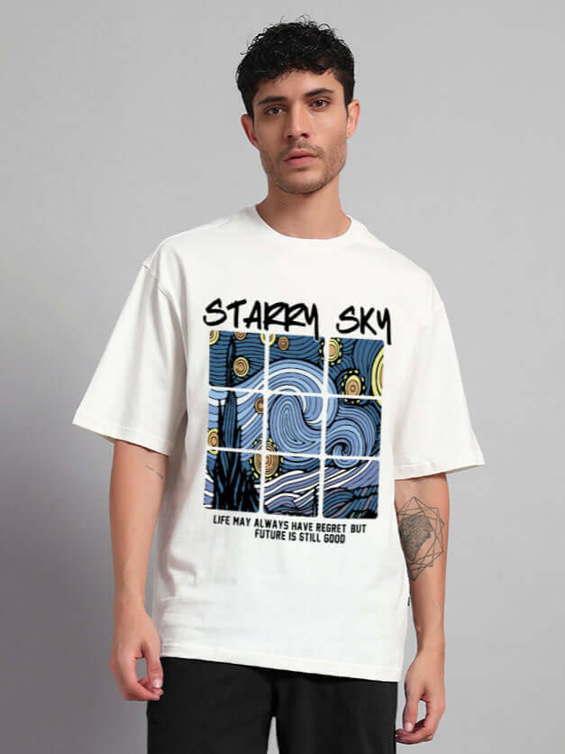 Man wearing Starry Sky oversized T-shirt in off white featuring a celestial graphic, relaxed fit, 220 GSM cotton fabric.