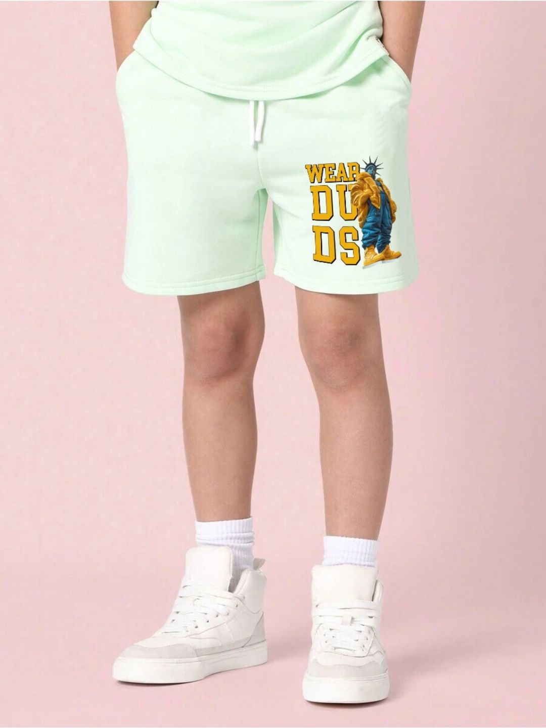 STATUE OF LIBERTY CO-ORD SET FOR BOYS AND GIRLS MINT GREEN showcasing mint green shorts with a graphic design on the side.