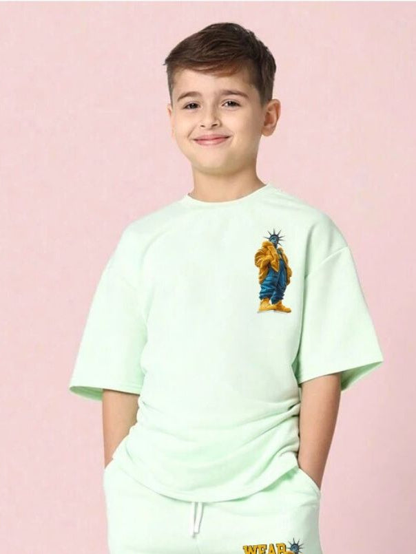 Boy wearing STATUE OF LIBERTY T-SHIRT FOR BOYS GIRLS MINT GREEN with artistic Statue of Liberty design, standing against pink background