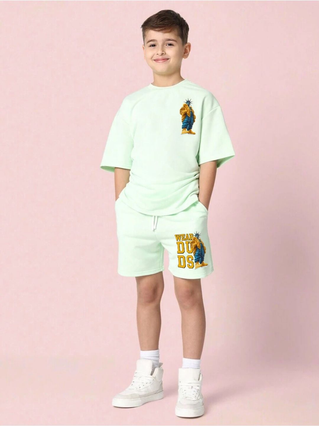 Kid wearing STATUE OF LIBERTY CO-ORD SET FOR BOYS AND GIRLS MINT GREEN against pink background