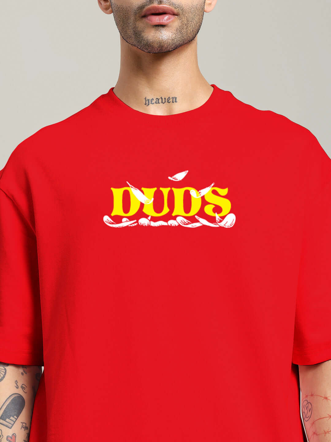 Person wearing STAY HAPPY PRINTED OVERSIZED T-SHIRT RED with bold yellow graphic.