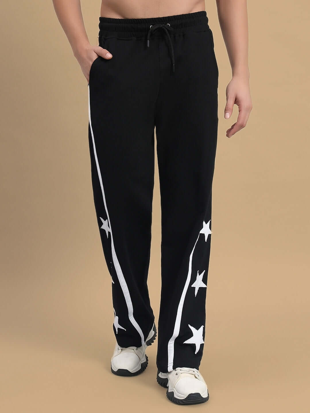 Stellar Relaxed Joggers in black with star design, made-to-order by DUDS, shown on model showcasing comfort and style.