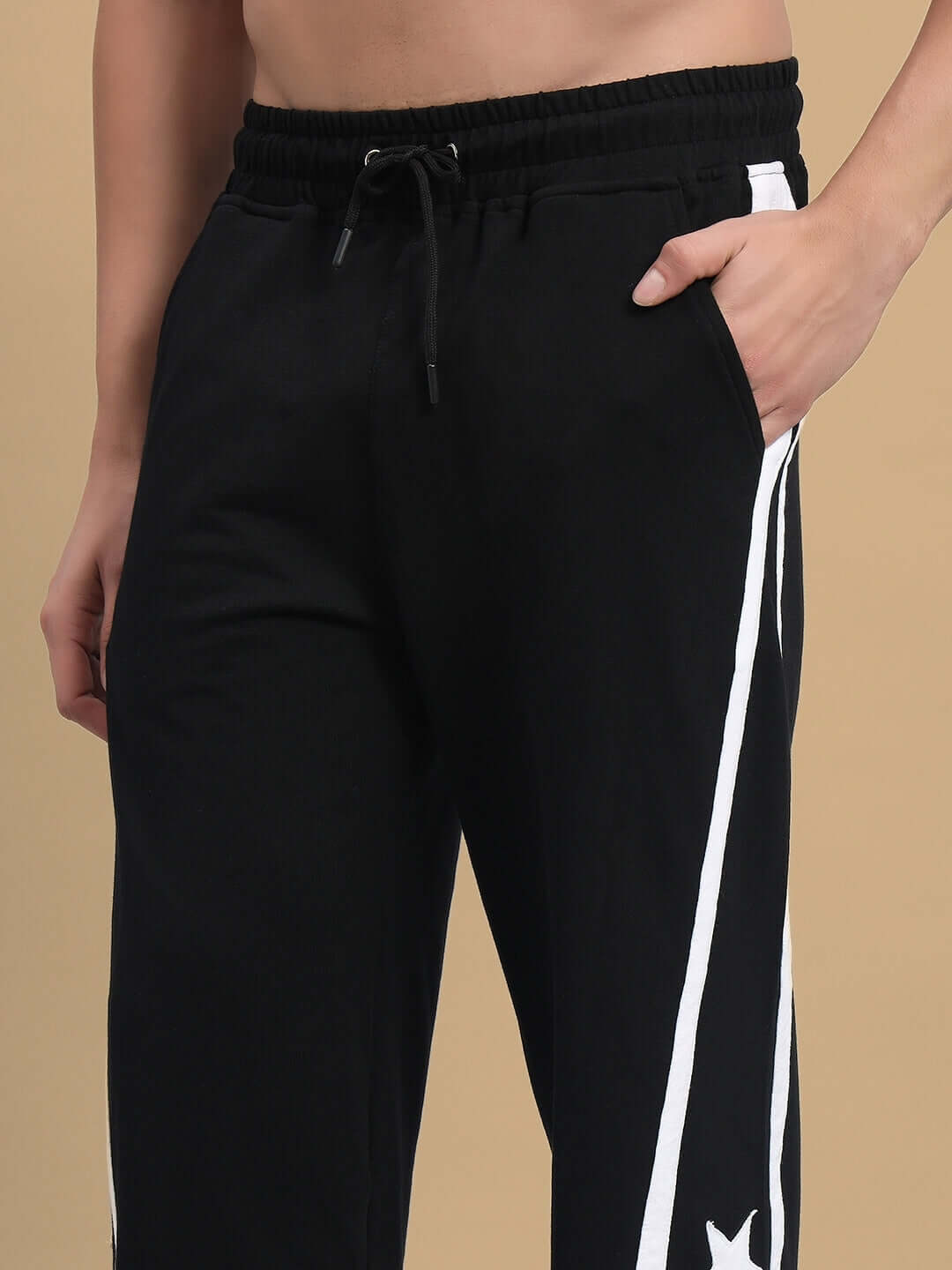 Model wearing Stellar Relaxed Joggers in black, featuring comfortable fit with custom size option by DUDS.