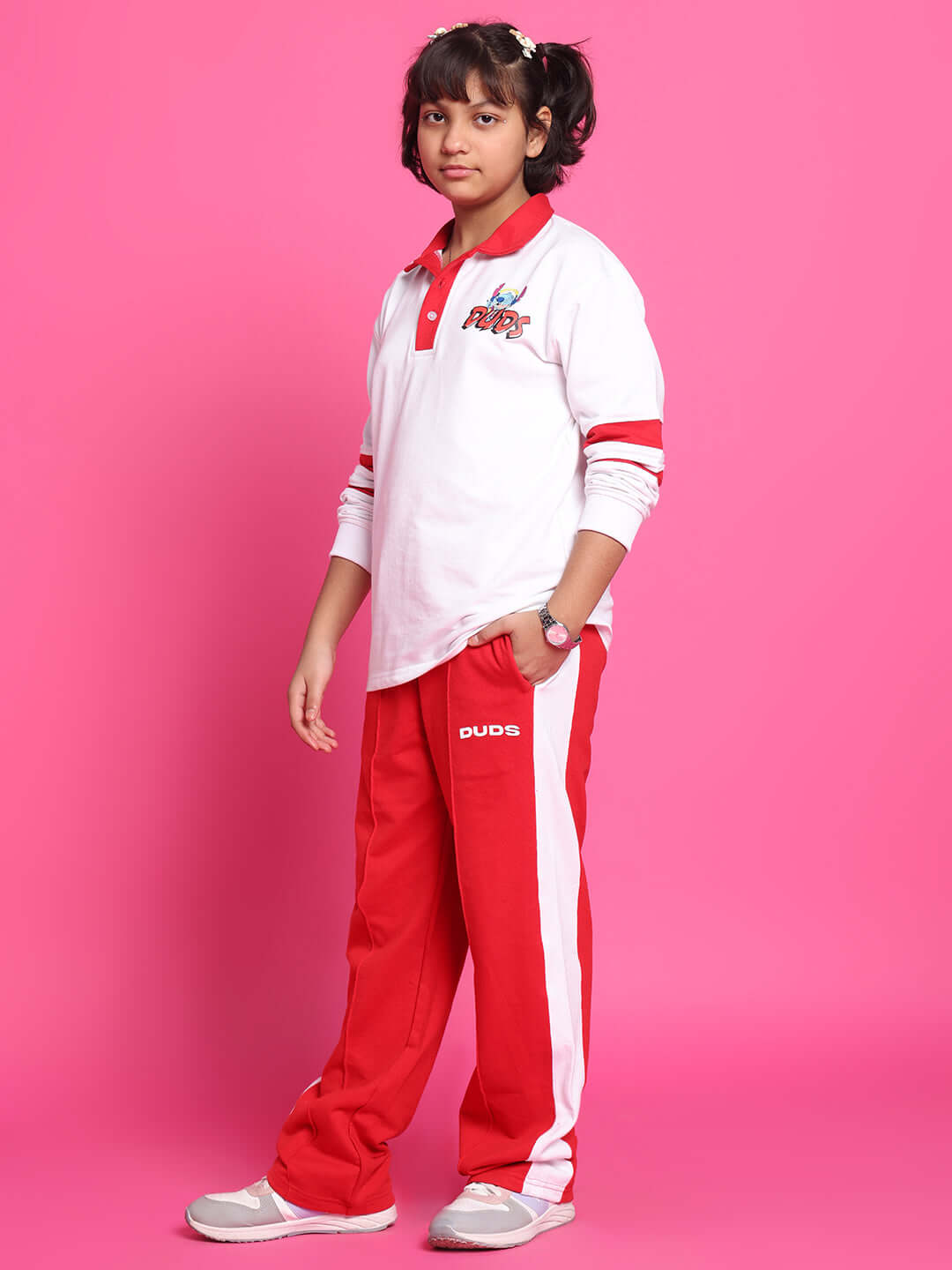 STITCH OVERSIZED SWEATSHIRT FOR BOYS GIRLS WHITE RED modeled against a pink background, showcasing casual and playful style.