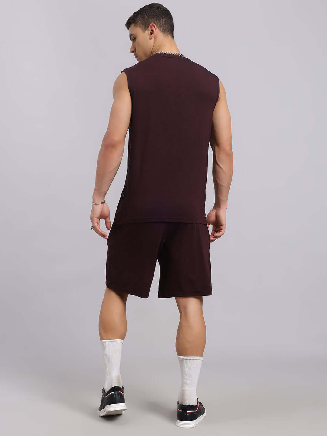 Back view of a man wearing a wine-colored Strength Freak Co-Ord Set; premium heavy gauge modal fabric from Color By Colours India.