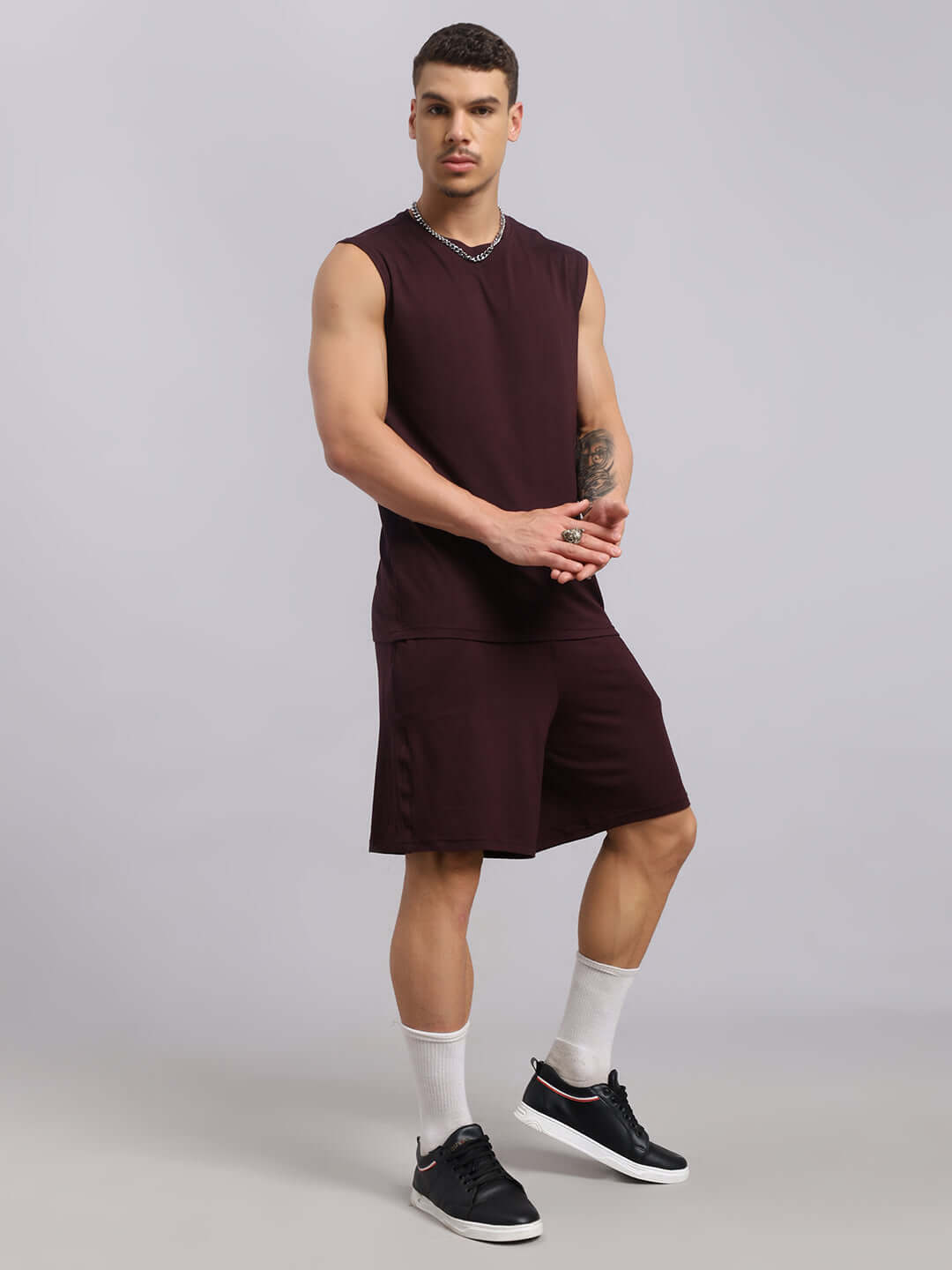 Man wearing STRENGTH FREAK Wine Co-ord Set made from premium modal fabric, showcasing casual athletic style, perfect for fitness.