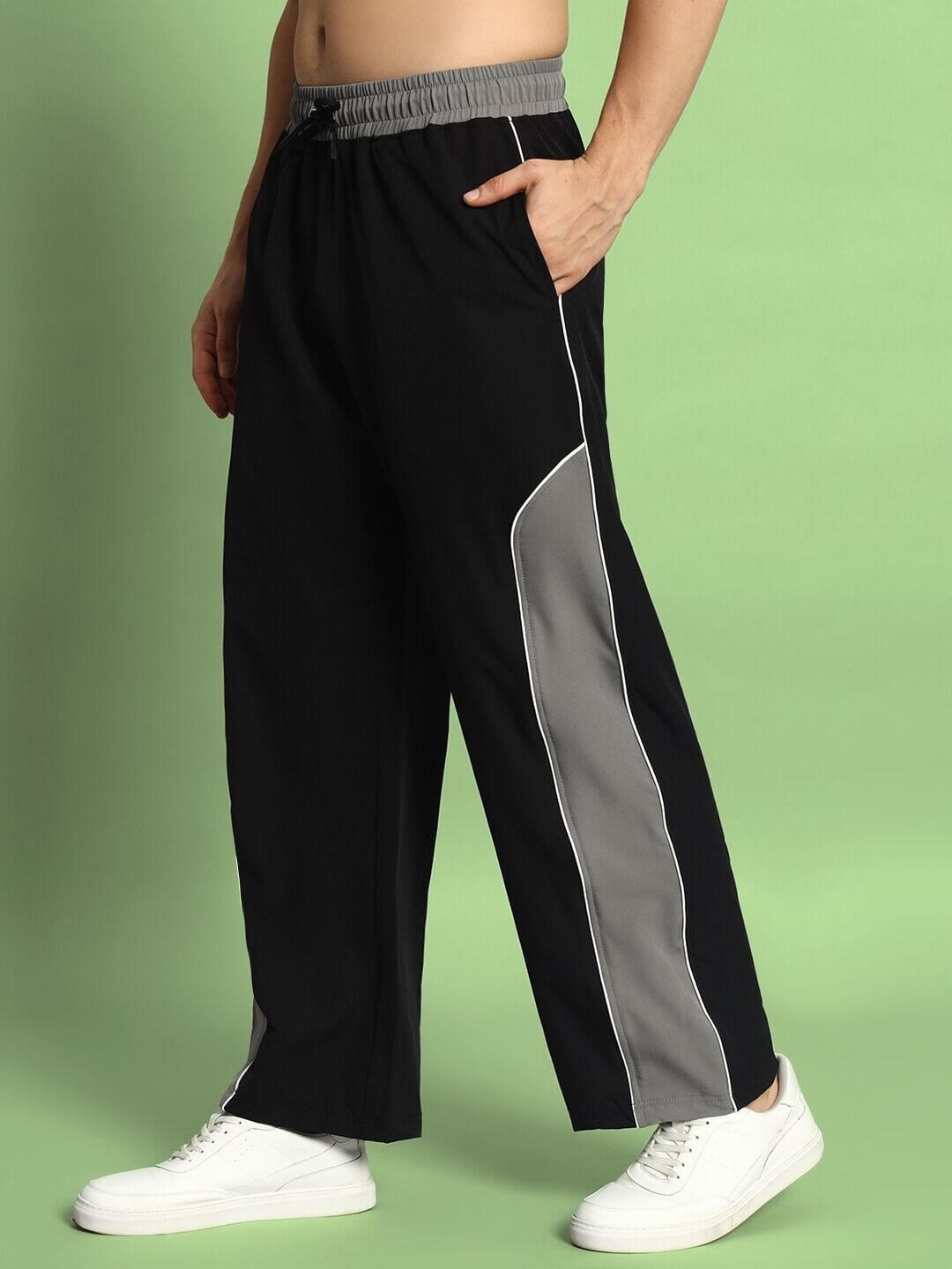 Black-grey relaxed fit cargo pants with white sneakers, suitable for custom sizing options and handmade precision.