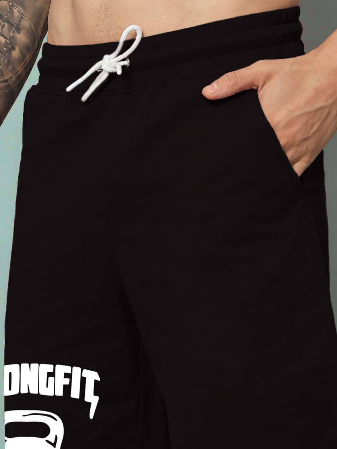 Close-up of Strongfit regular fit black shorts with drawstring and pocket detail.
