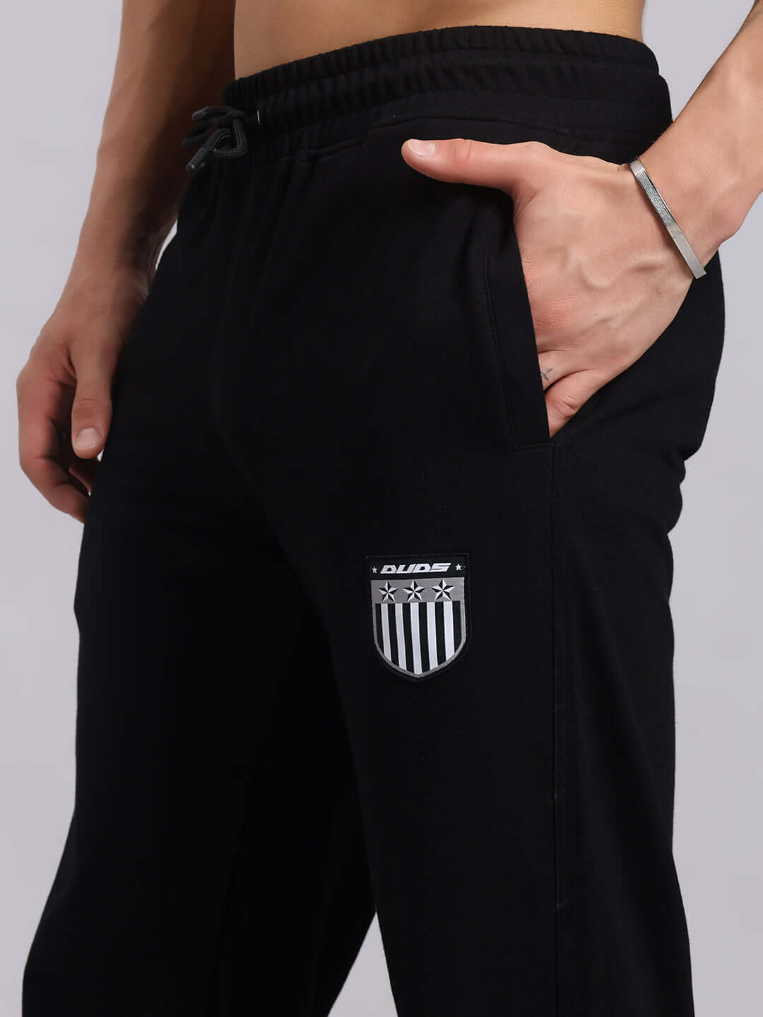 Person wearing black Stunner Relaxed Fit Jogger, showcasing back view with stylish design