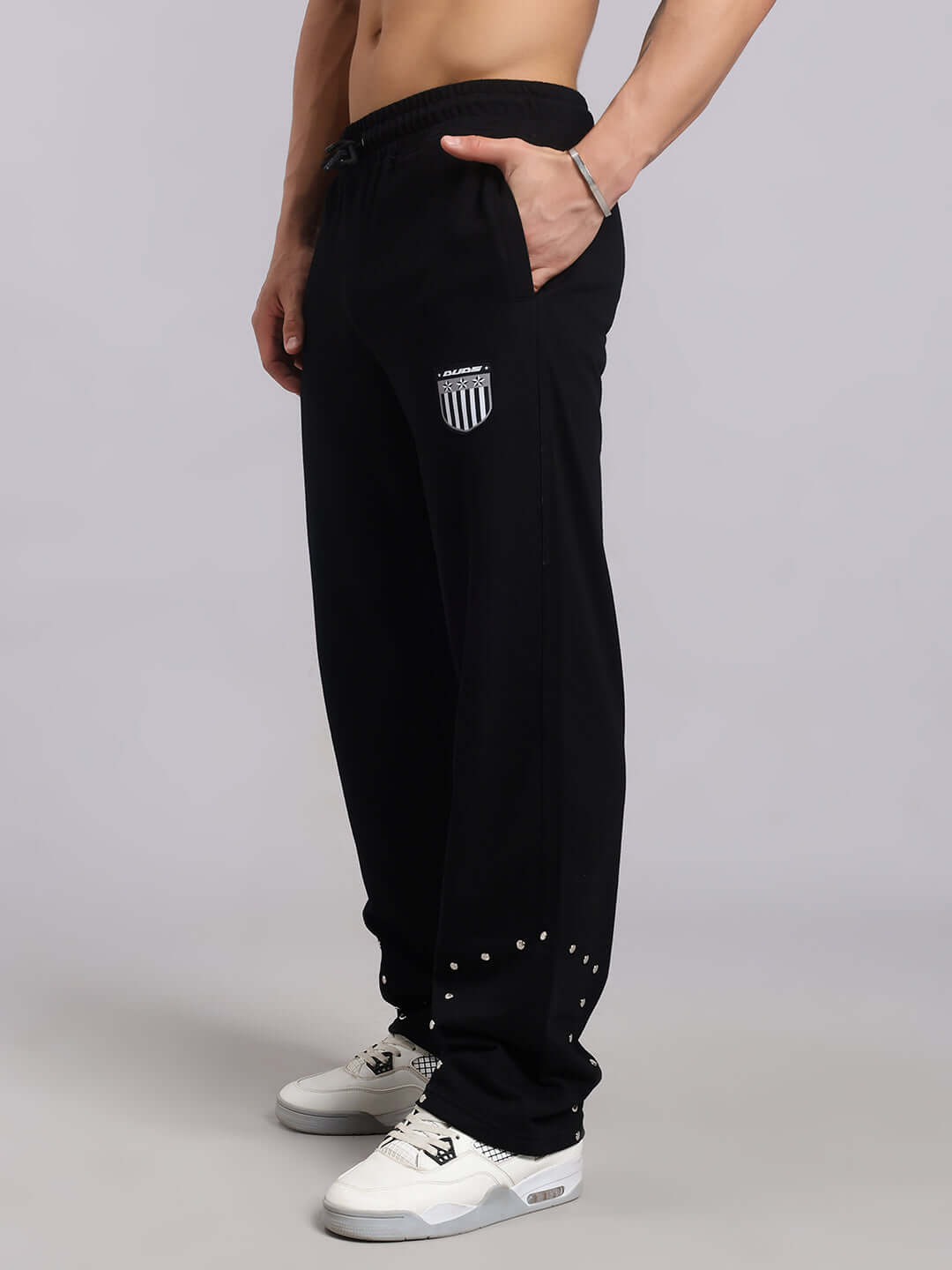 Model wearing Stunner Relaxed Fit Jogger in black, featuring a casual design with adjustable waistband and logo detail.
