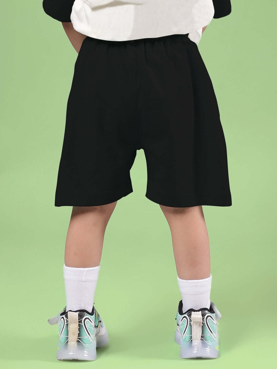 STYLISH ROBOT CO-ORD FOR BOYS & GIRLS OFF WHITE BLACK shorts on child with green background