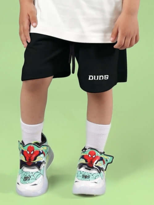 Child wearing STYLISH ROBOT SHORTS FOR BOYS & GIRLS BLACK from DUDS, featuring cool design for active play.