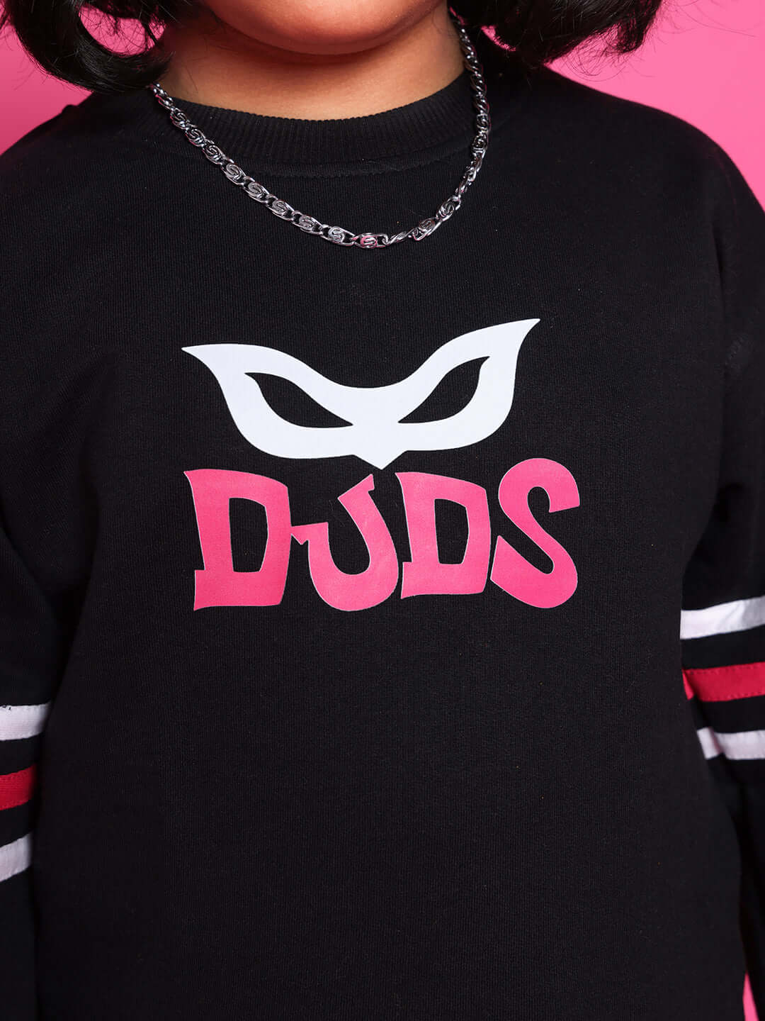 Child wearing SUPER CHAMP CO-ORD FOR BOYS GIRLS BLACK with logo, featuring sleek black design and motivational style for confidence building.