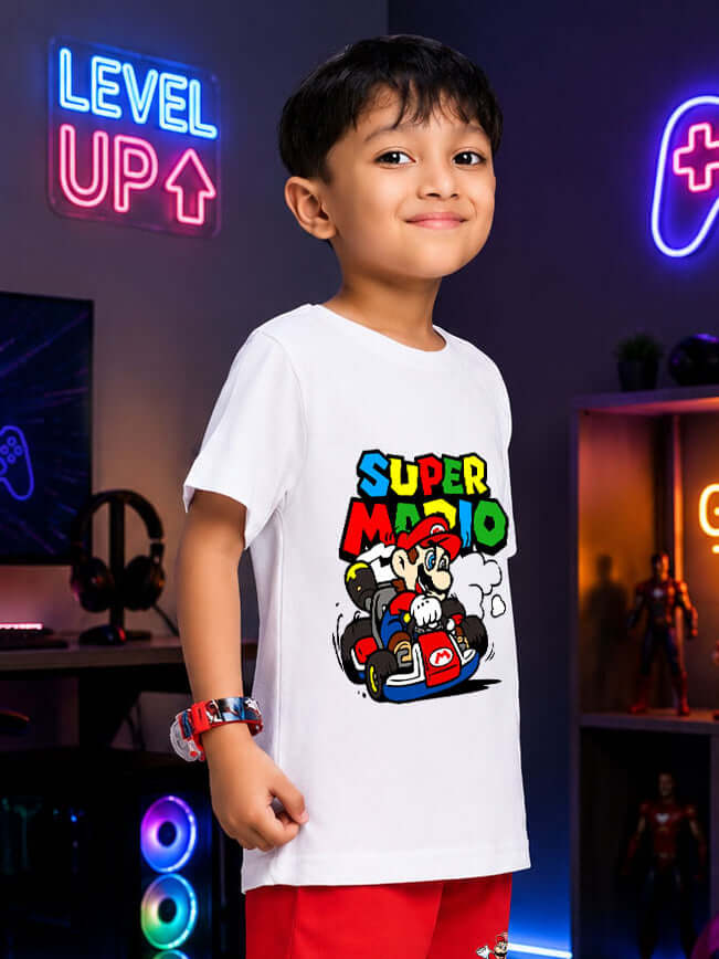 SUPER MARIO GRAPHIC T-SHIRT FOR BOYS GIRLS WHITE worn by boy in gaming room, colorful design.