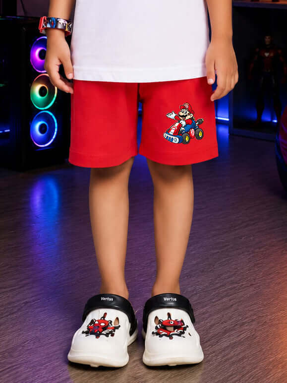 SUPER MARIO COOL SHORTS FOR BOYS GIRLS RED worn by a child, featuring Mario on a go-kart design.