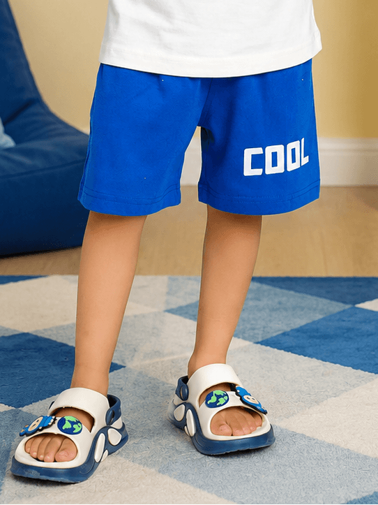 SUPER SQUAD COOL SHORTS FOR BOYS GIRLS BLUE worn by a child, showcasing stylish casual fashion and comfort.