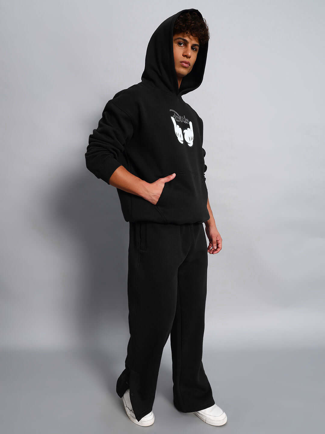 Model wearing WEARDUDS SUPREME FLEECE CO-ORD BLACK, showcasing custom fit black hoodie and pants set from DUDS.