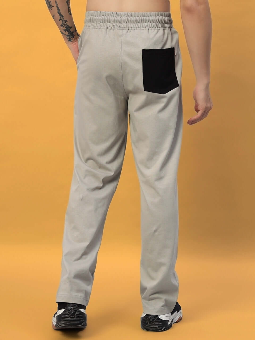 Back view of grey SURFING JOGGER by DUDS, featuring a black pocket detail, designed by experienced tailors for comfort and style.