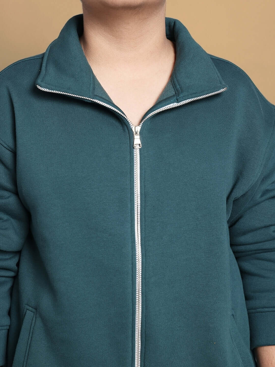 Teal green shaggy fleece jacket for kids with zip closure, customizable size options available, tailored by experienced craftsmen at DUDS.