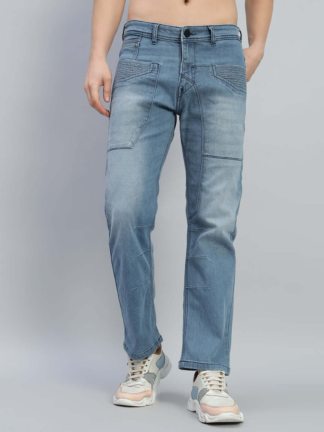 Model wearing Thrifty regular fit denim jeans in blue, highlighting custom fit option by DUDS, front view.