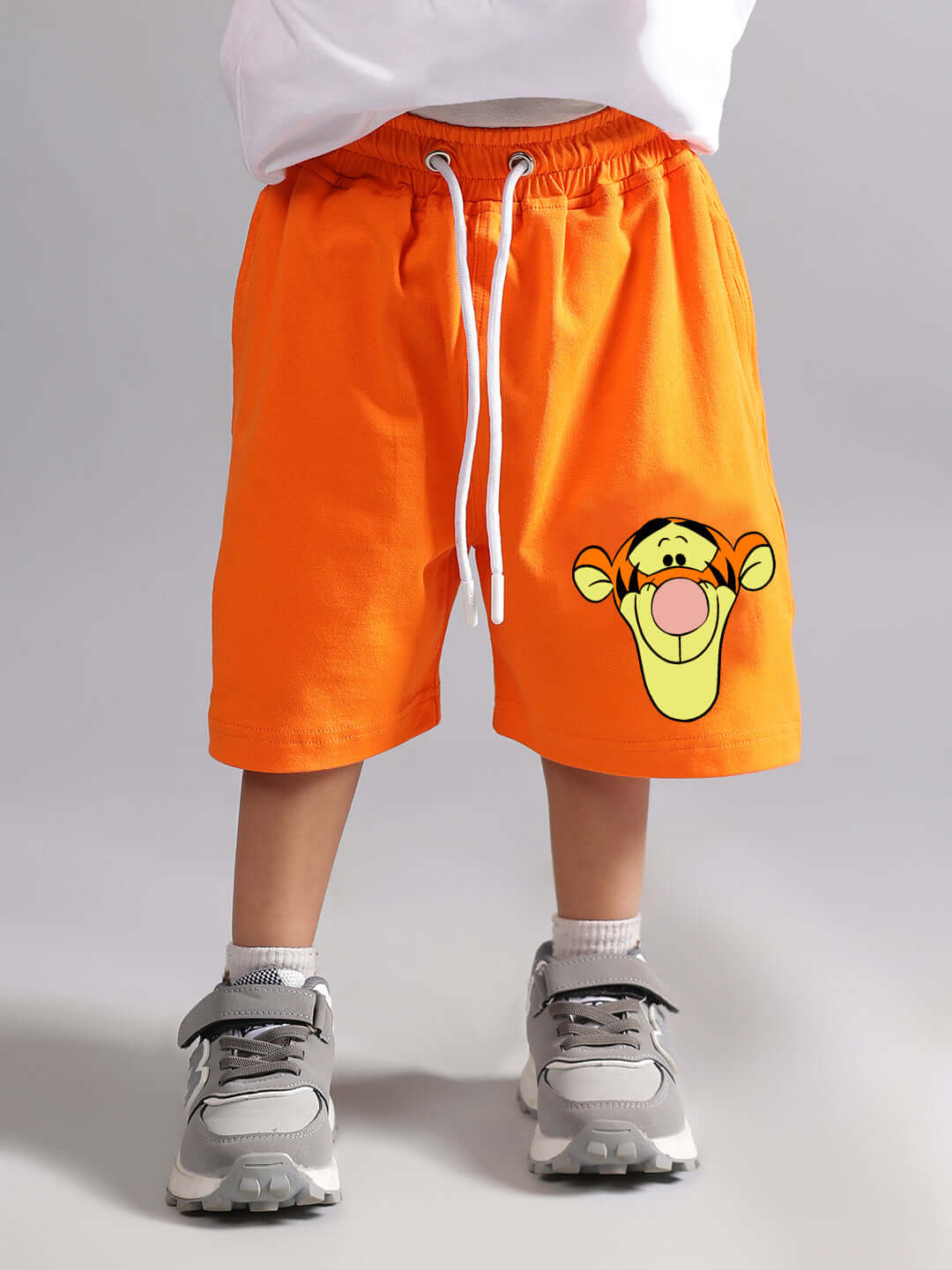 Orange tiger shorts for boys and girls, featuring a fun design, available for custom fit with dedicated craftsmanship by DUDS.