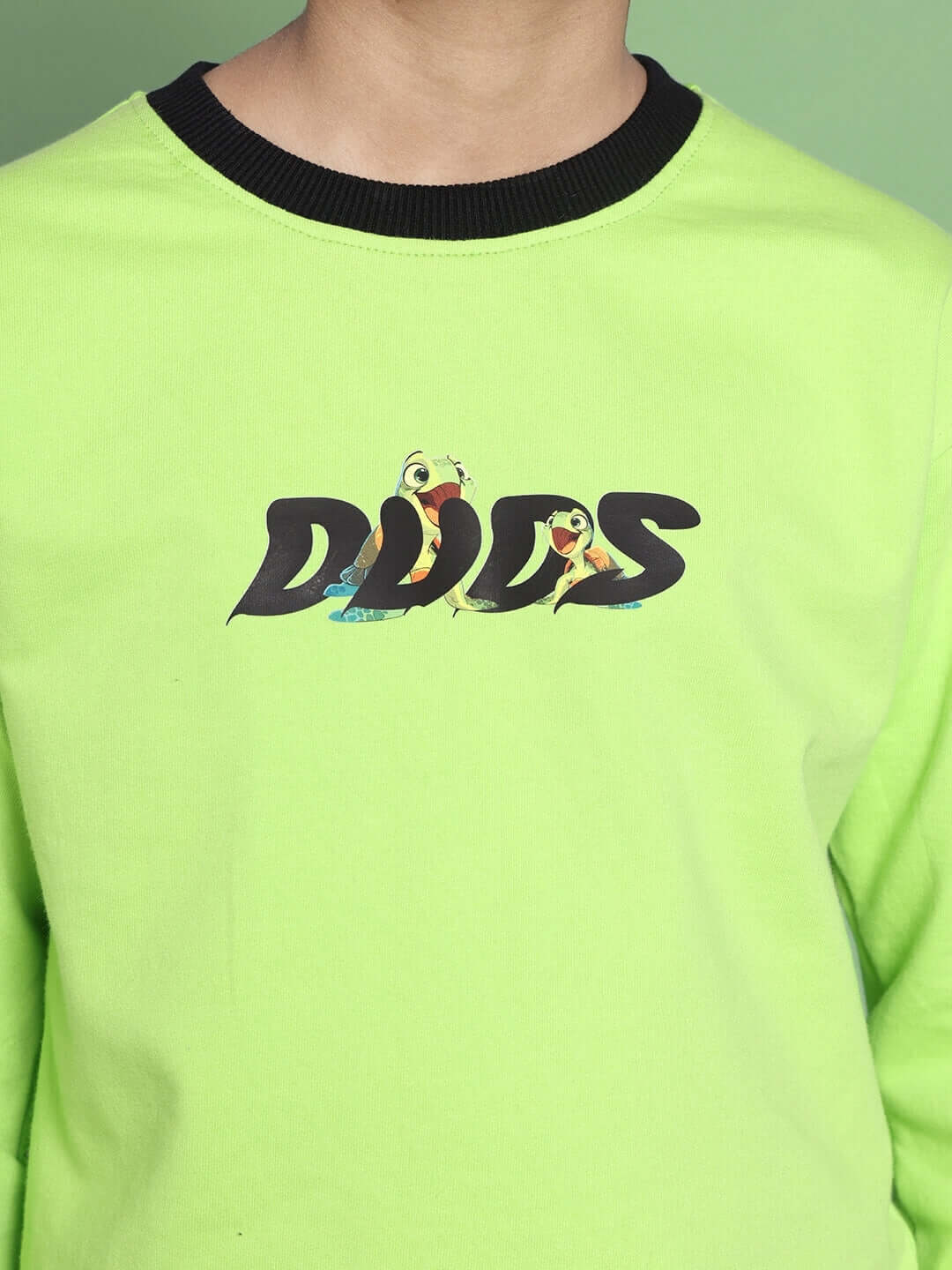 Boy wearing TILLY OVERSIZED SWEATSHIRT FOR BOYS GIRLS NEON GREEN with graphic print