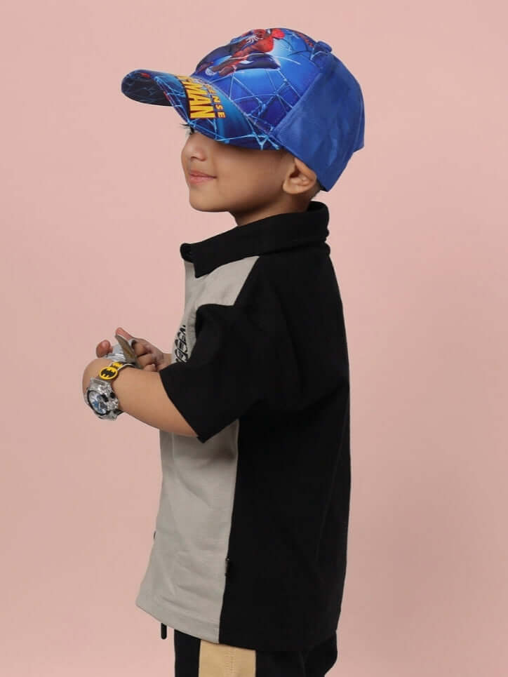 Child wearing TINGE SHIRT FOR BOYS & GIRLS GREY-BLACK, side view. Shirt paired with colorful cap, showcasing trendy and comfortable style.