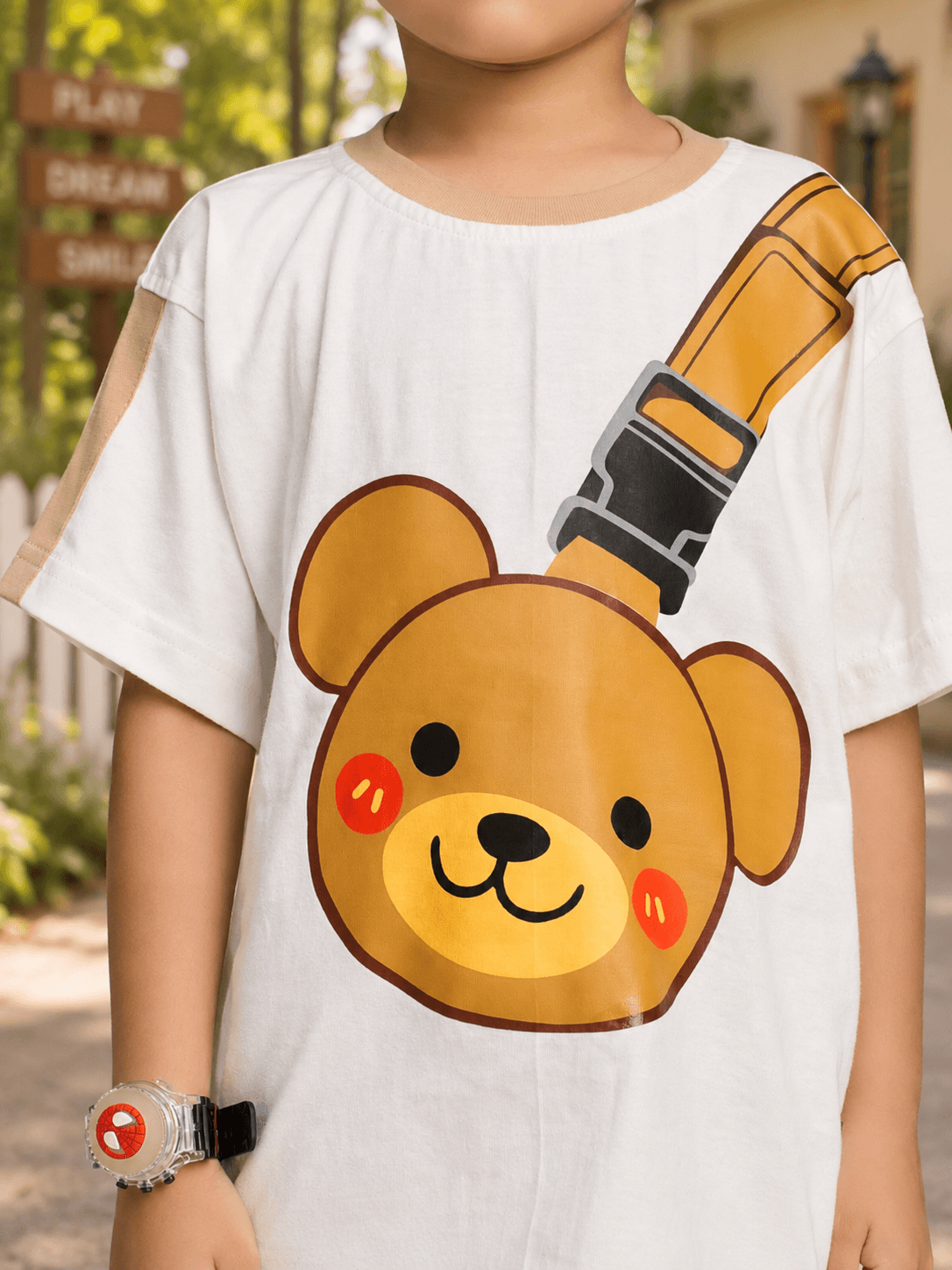 TINY TREND BEAR T-SHIRT FOR BOYS GIRLS WHITE with adorable bear graphic on a boy, showcasing playful fashion.