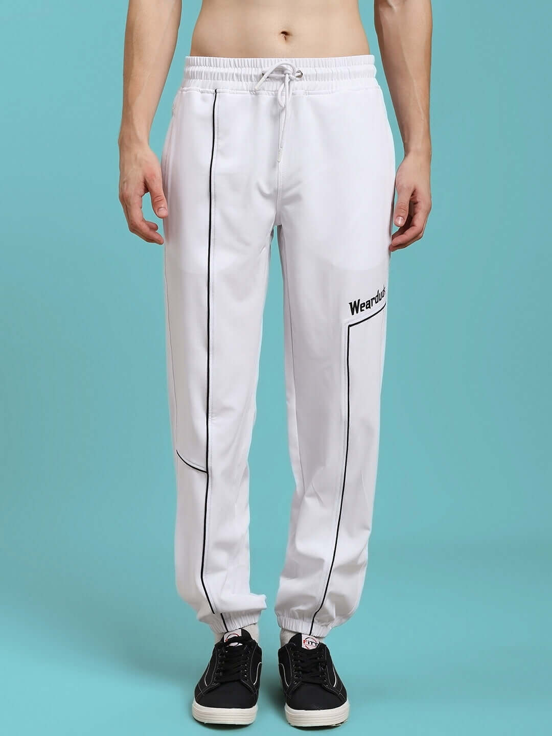 Man wearing Tokyo relaxed fit joggers in white, showcasing tailored design and customizable fit from DUDS.