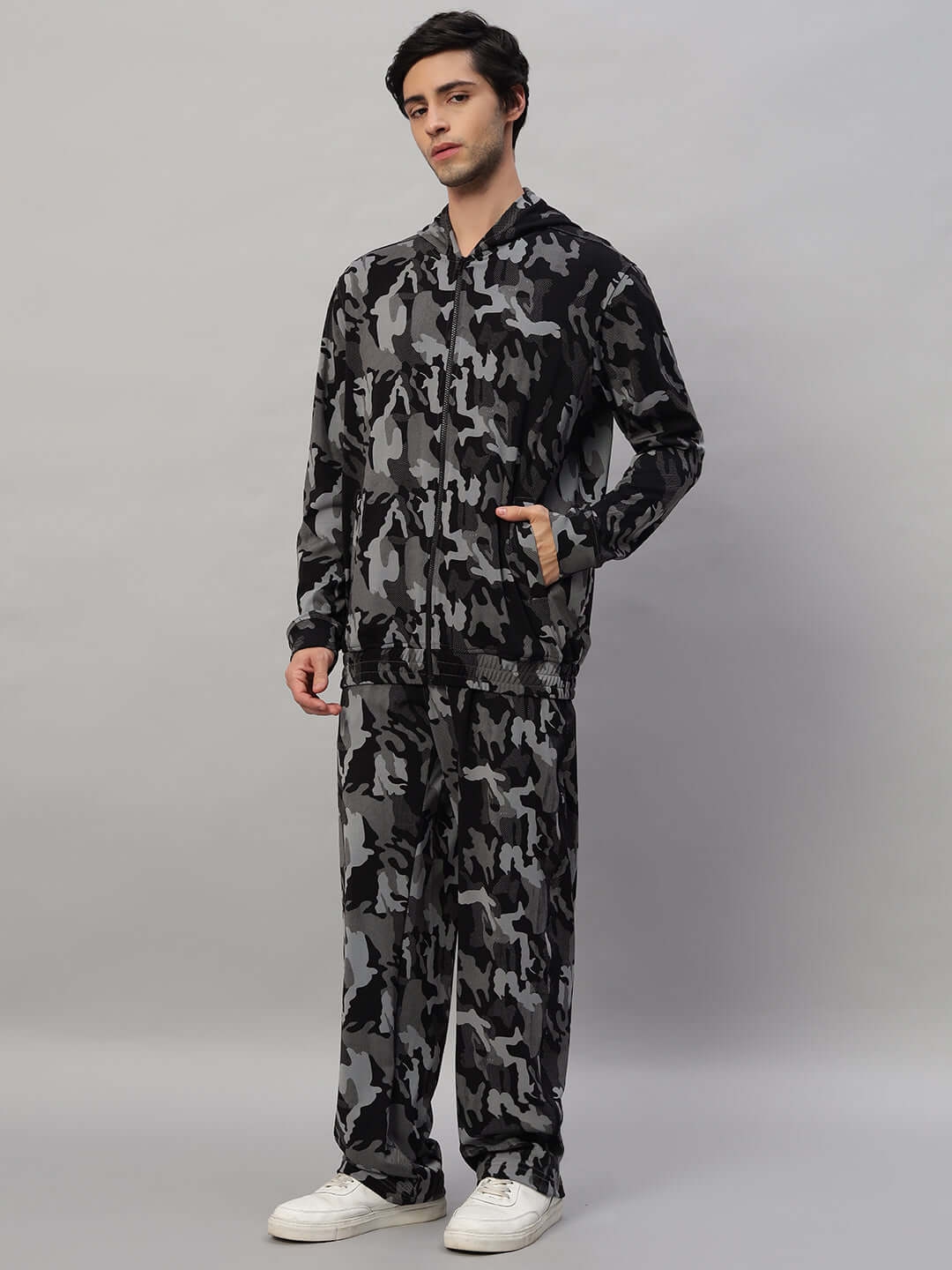 Man wearing TRENCH CO-ORD SET CAMOUFLAGE NAVY made of 90% polyester and 10% spandex, ideal for versatile styling and comfort.