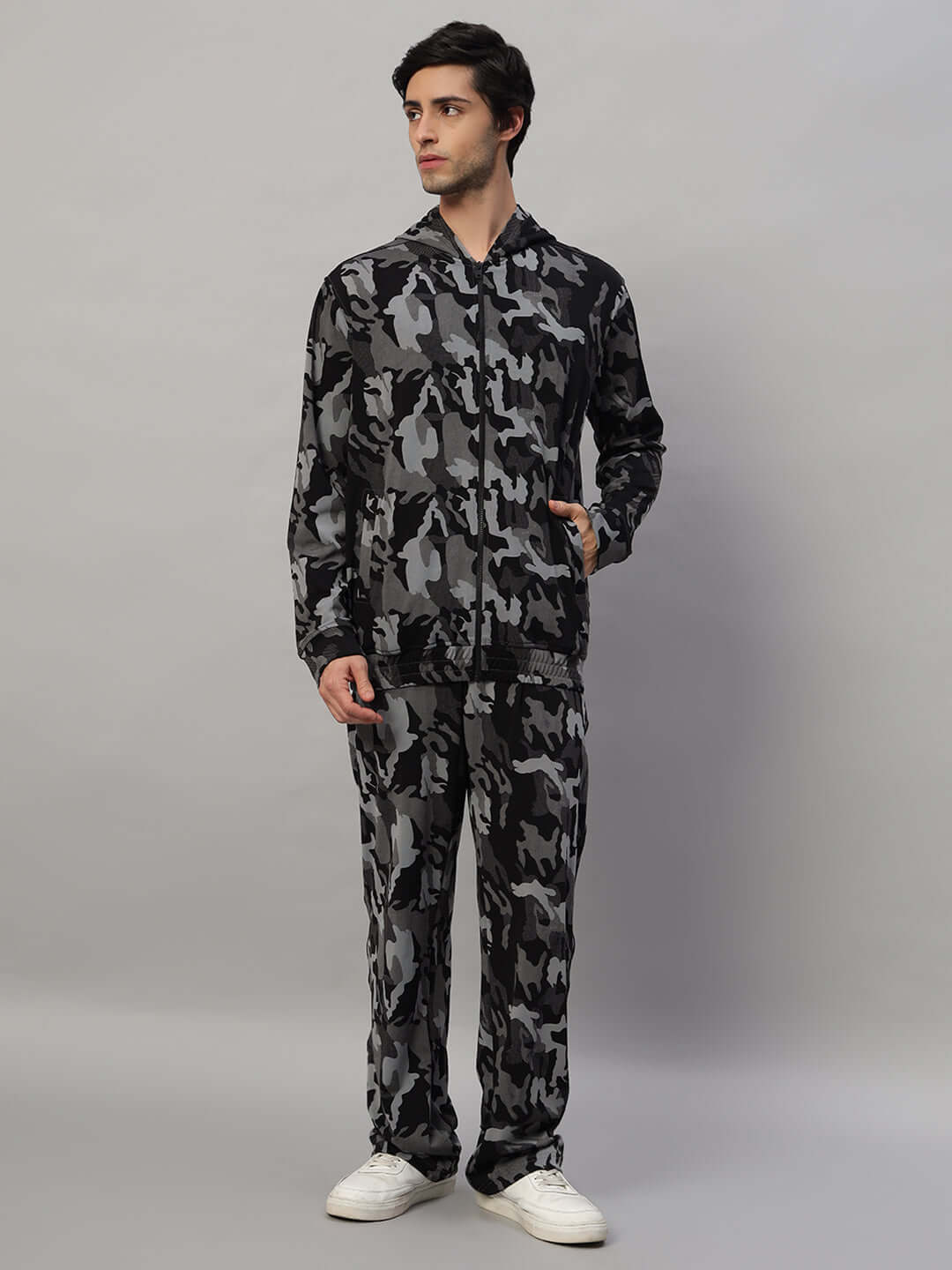 Model wearing TRENCH CO-ORD SET in camo navy, featuring polyester-spandex blend. Ideal for stylish comfort; machine wash cold.