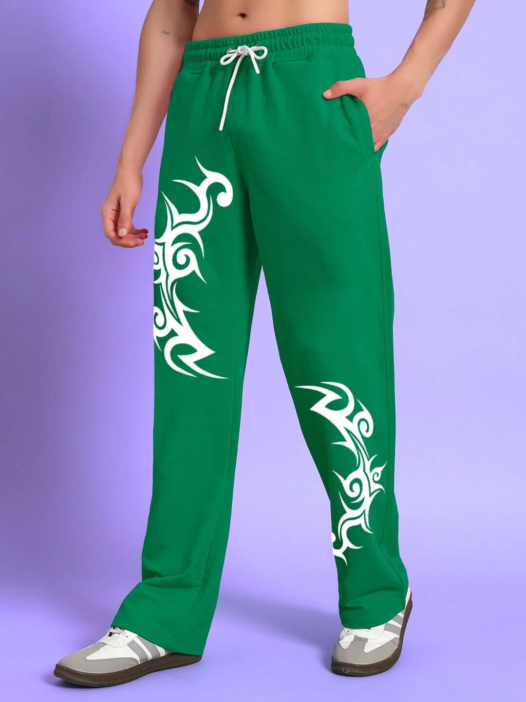 Green jogger pants with tribal patterns, customizable fit made by DUDS. Tailored for comfort and style, ships in 7-10 days.