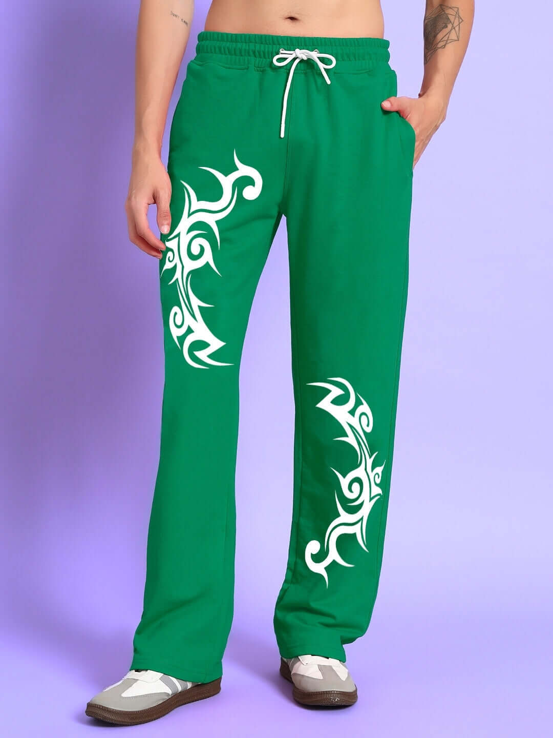 Green TRIBAL STRONG SENSE jogger with white tribal design, customizable fit, made by DUDS tailors. Prepaid orders only.