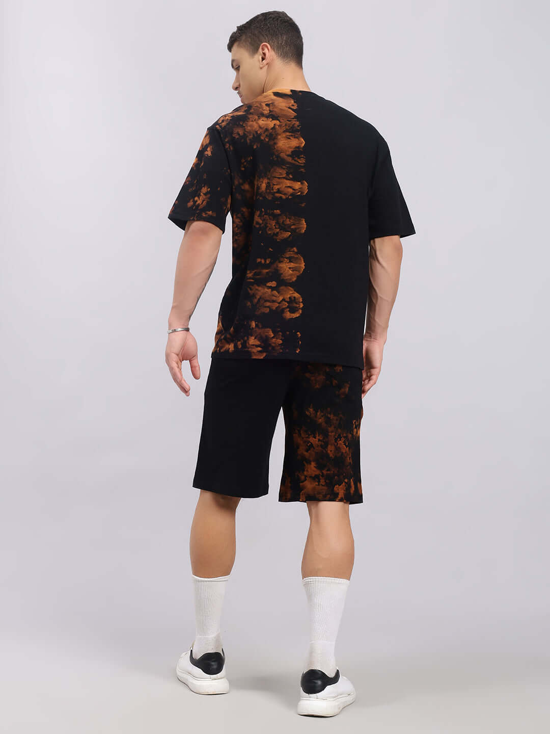 Back view of Trickster Tie-Dye Co-ord Set in black, featuring premium cotton French terry fabric and elastane, for a trendy style.