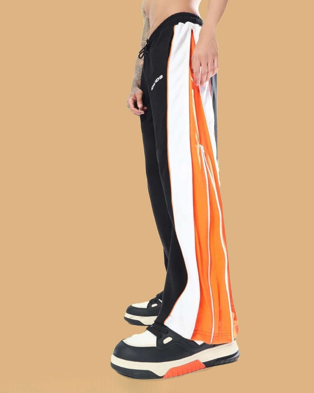 TRIUMPH multi zipper joggers in black and orange with customizable fit