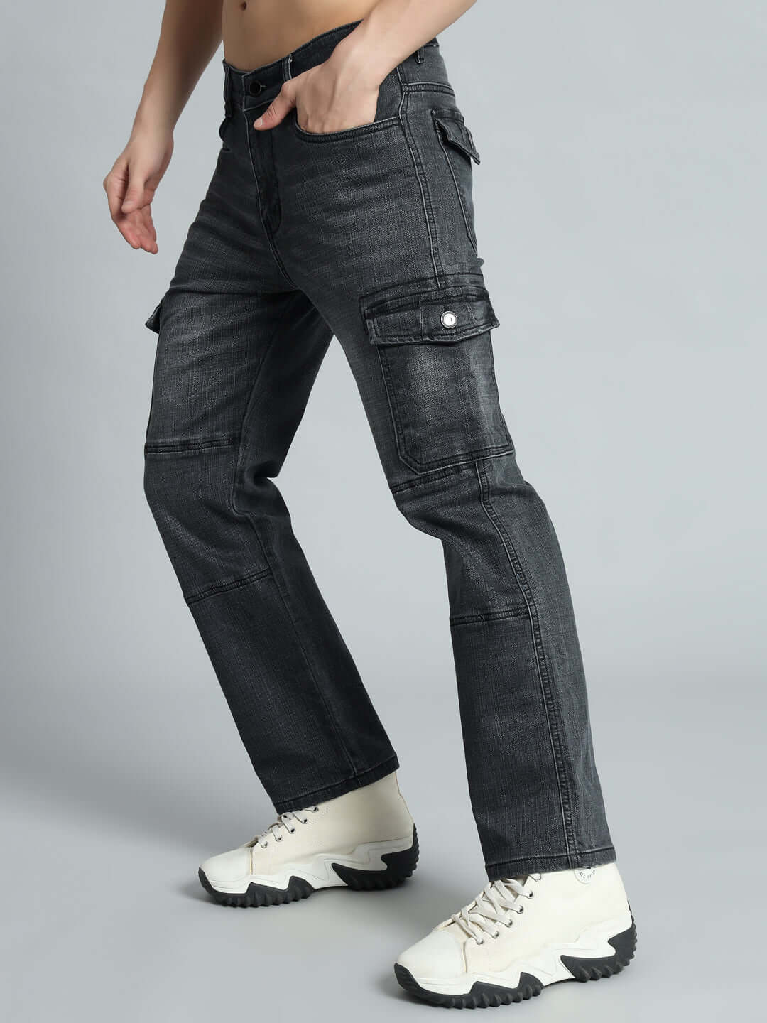 Model wearing TYRO RELAXED DENIM CARGO in grey with multiple pockets, showcasing a casual and stylish design, ideal for custom-fit orders.