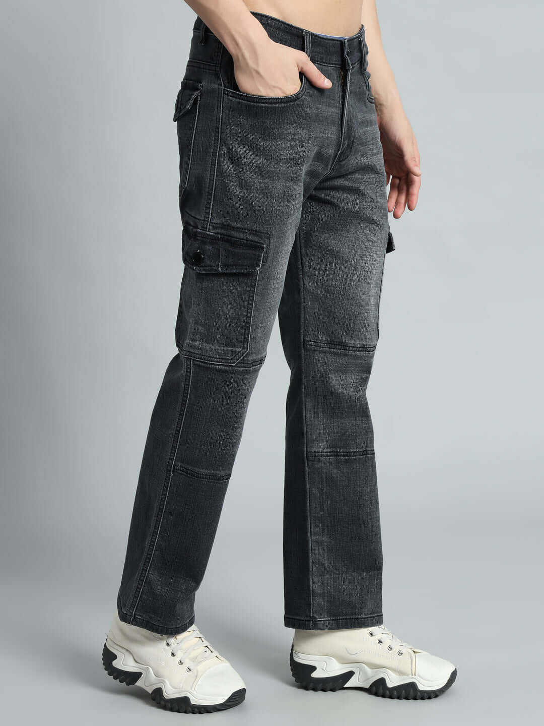 Grey TYRO Relaxed Denim Cargo Pants with pockets, styled with white sneakers, made-to-order by DUDS.
