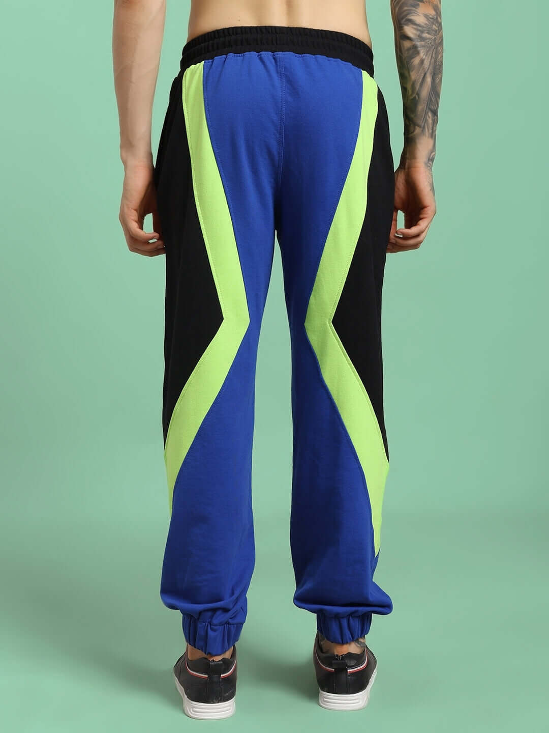 Back view of ULTRA COLORBLOCK RELAXED-FIT JOGGERS BLUE-BLACK showcasing bold design and modern relaxed-fit silhouette.