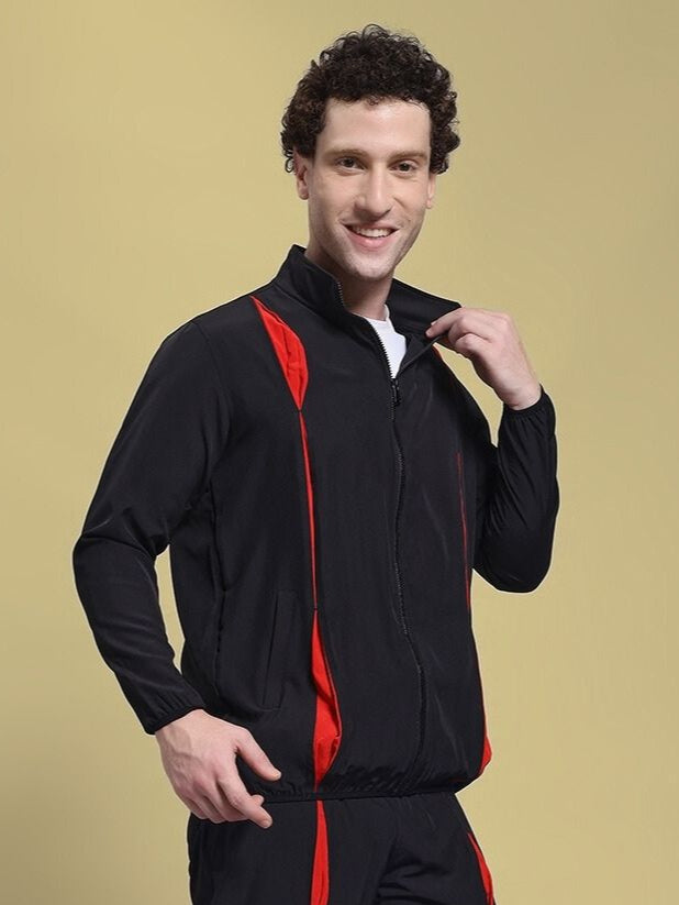 Man wearing UNISON RELAXED FIT JACKET BLACK RED, ideal for kids' casual fashion, showing jacket's design and comfortable fit.