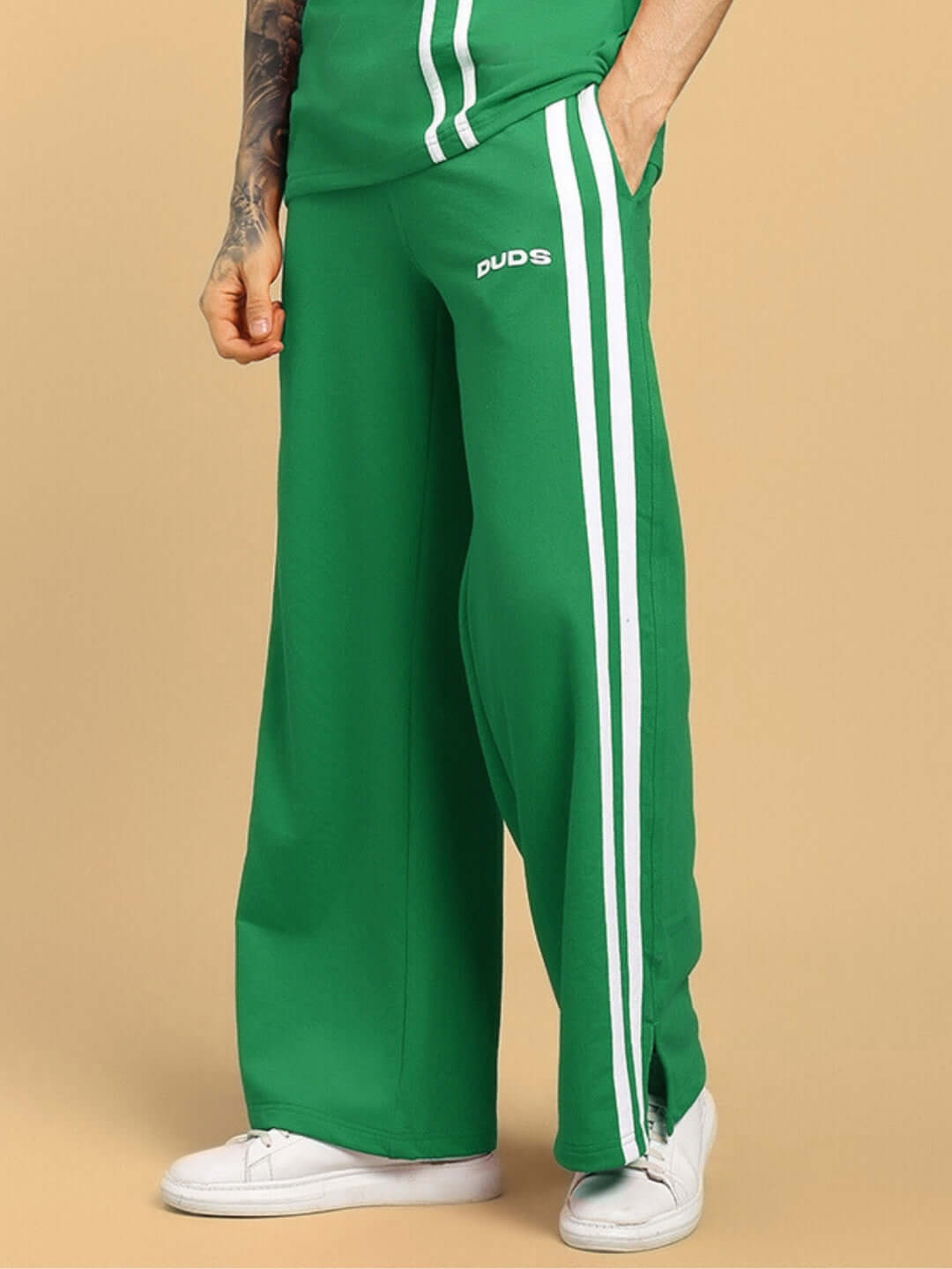 Green United Stripe Joggers by DUDS with dual white stripes, shown with a casual fit made for customizable wear.